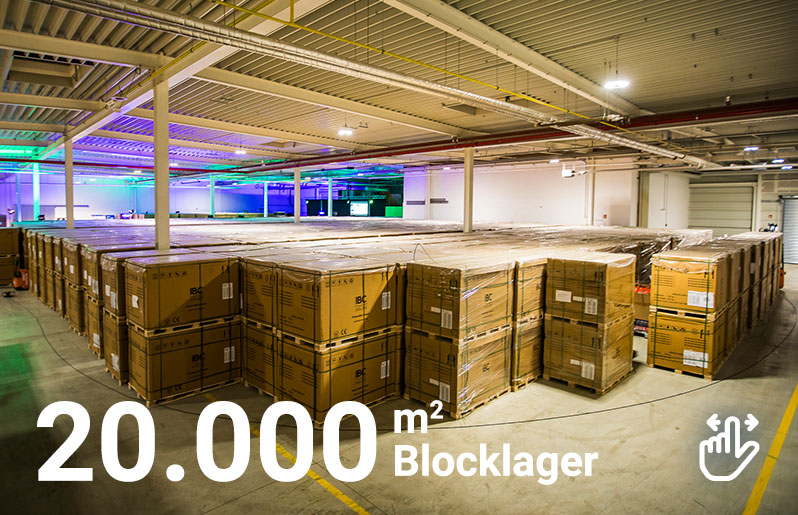 Abbildung eines Blocklagers mit Pflastersteinen auf Paletten